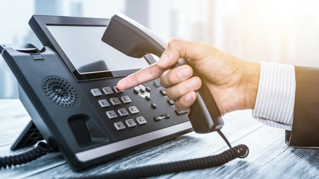 voip connected handset with finger making calls